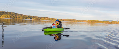 A mother and baby enjoying the open waters whilst inisde of a kayak