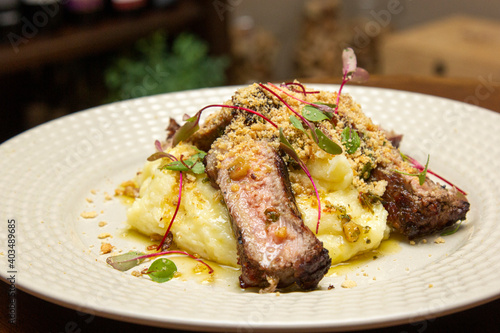 Ancho with Aligot, Chimichurri and fried pork flour. photo