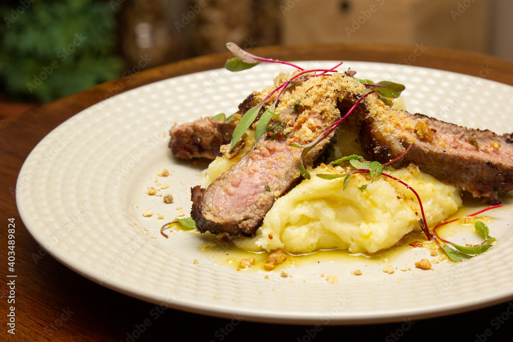 Ancho with Aligot, Chimichurri and fried pork flour.