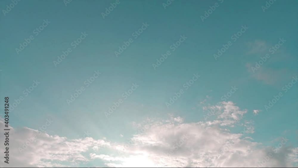 Bright sun light ray n bokeh sunbeam flare shining through white cloud n moody gray cumulus cloudscape on beautiful sunny sunrise or sunset blue sky in summer sunlight, 4k cinemagraph b-roll TimeLapse Bright sun light ray n bokeh sunbeam flare shining through white cloud n moody gray cumulus cloudscape on beautiful sunny sunrise or sunset blue sky in summer sunlight, 4k cinemagraph b-roll TimeLapse
