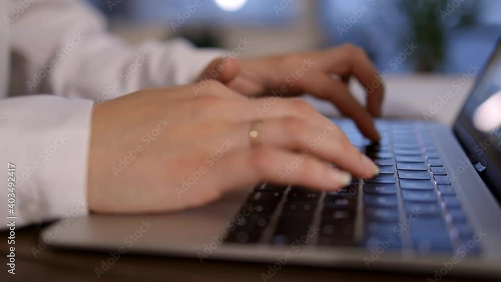 Young woman taps on her computer - videoclip Young woman taps on her computer - videoclip