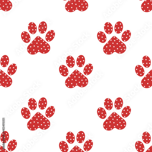 Seamless pattern of pink cat paws with white polka dots for printing on cups, textiles, clothing, gliders. 