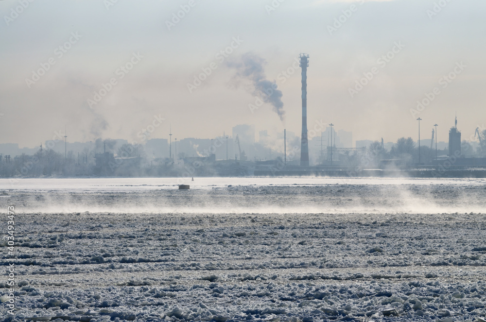 The water in the port was covered with ice from the frost.