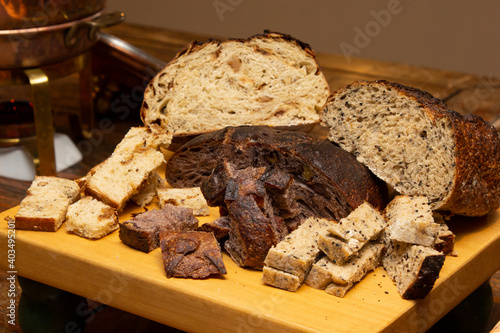 Delicious slices of homemade bread on the wooden board.