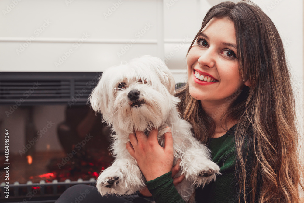 Young beautiful female posing with her white dog Young beautiful female posing with her white dog