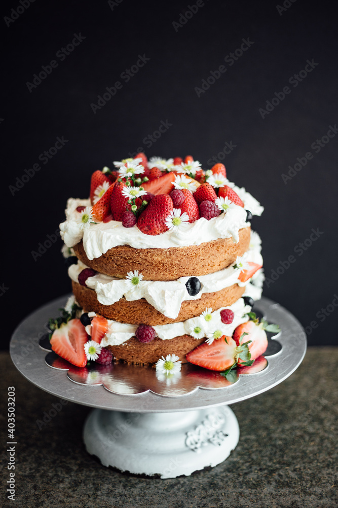 Cake with strawberries on dark background
