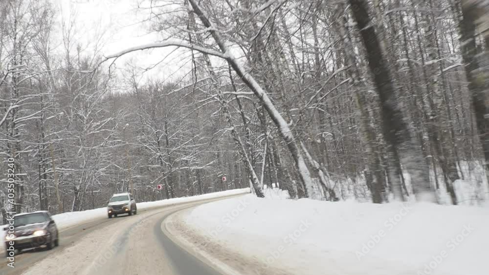 Winter Driving Curvy Snowy Country Road Curvy snowy country road leading through a forest mountain landscape Winter Driving Curvy Snowy Country Road Curvy snowy country road leading through a forest mountain landscape