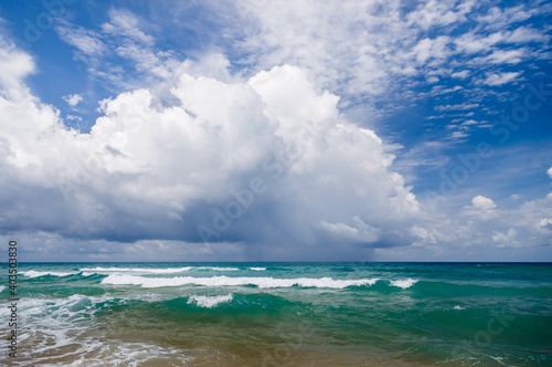 Fototapeta Naklejka Na Ścianę i Meble -  Seascape, small waves with white foam on the background of blue water.