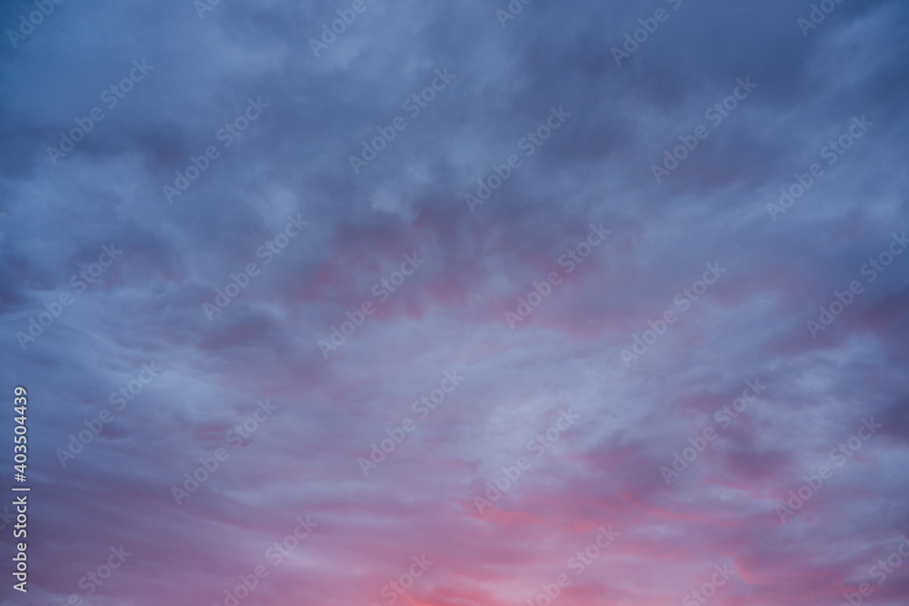 Beautiful crimson sunset. Cloudy background in red colors.