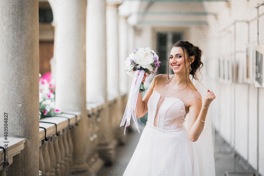 Naklejka premium Bride holding big and beautiful wedding bouquet with flowers