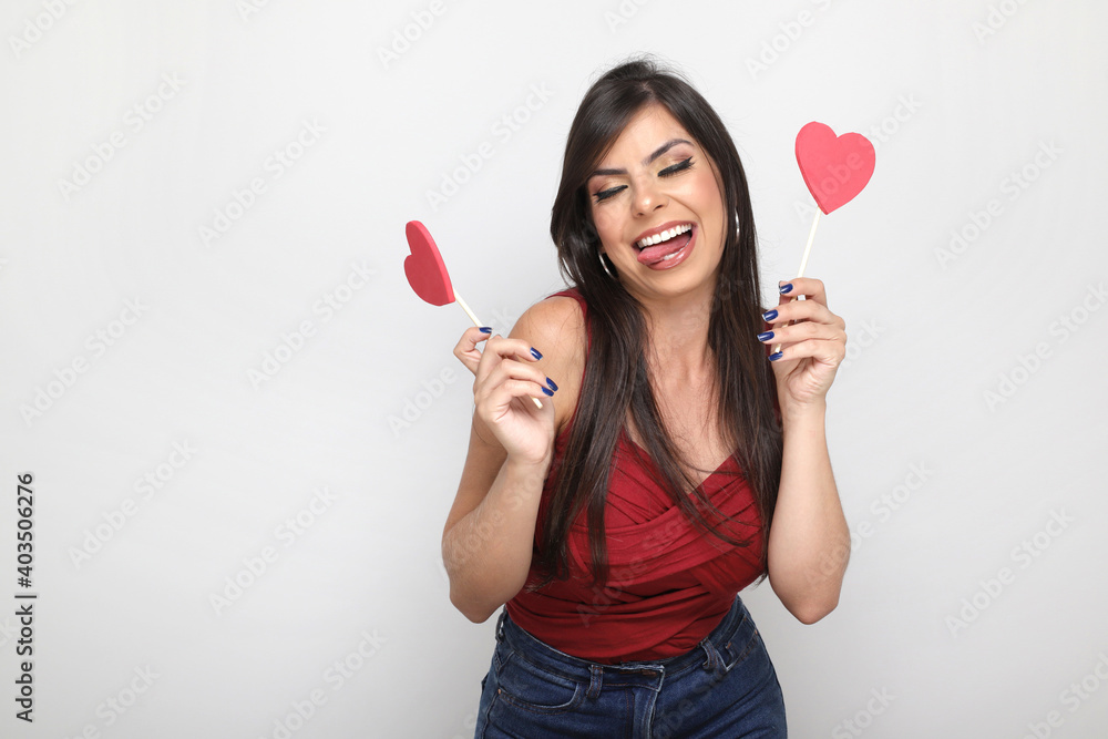 beautiful girl holding valentine's gift on white background beautiful girl holding valentine's gift on white background