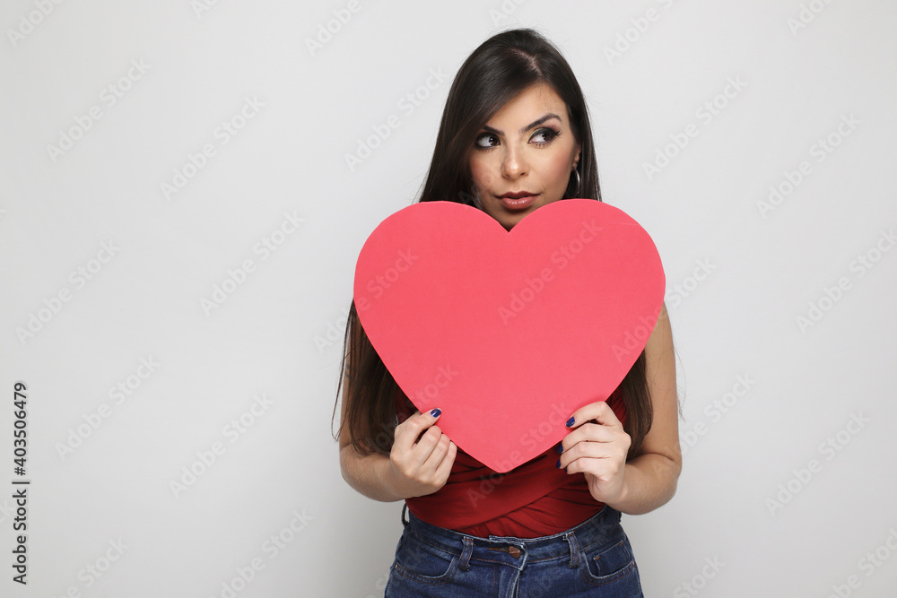 beautiful girl holding valentine's gift on white background beautiful girl holding valentine's gift on white background
