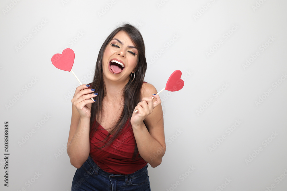 beautiful girl holding valentine's gift on white background beautiful girl holding valentine's gift on white background