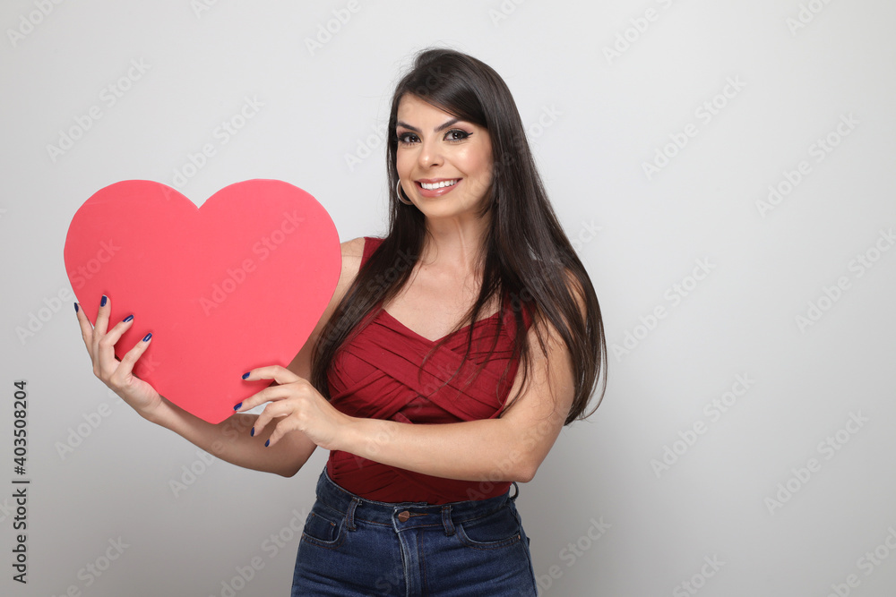 beautiful girl holding valentine's gift on white background beautiful girl holding valentine's gift on white background