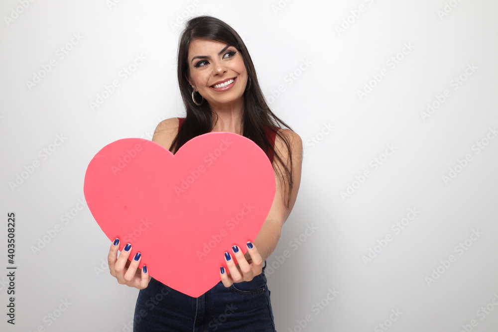 beautiful girl holding valentine's gift on white background beautiful girl holding valentine's gift on white background