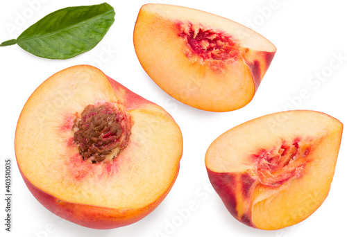 peach fruit with green leaf and slices isolated on white background. full depth of field. clipping path