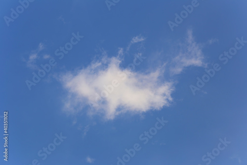 Blue sky with white clouds in the daytime background.