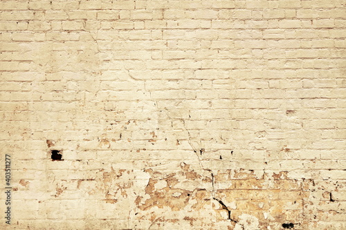 Yellow Grunge Peeling Wall. Old Damaged Brick Wall Broken Background. Block Material With Paint Over War Brickwork. Block Mortar Texture. © Polina Zait