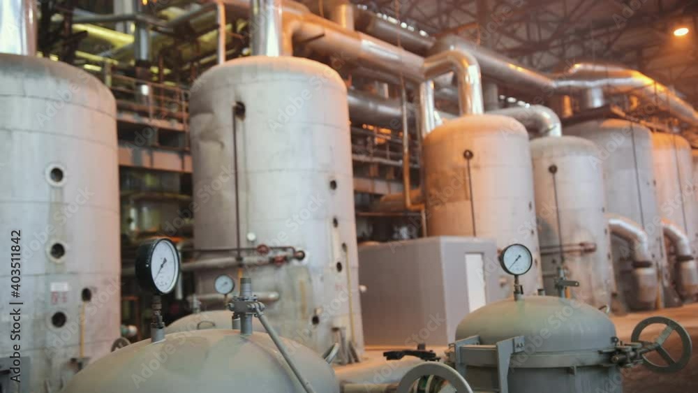 Manometer pipes and valve in boiler room. Thermal power plant piping at modern factory. Sugar beet production plant Manometer pipes and valve in boiler room. Thermal power plant piping at modern factory. Sugar beet production plant