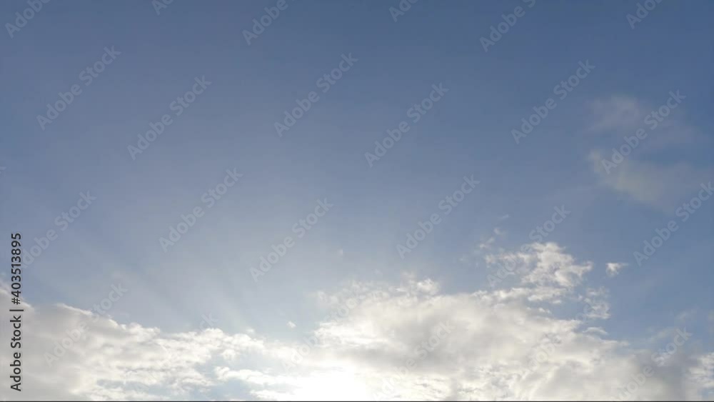 Bright sun light ray n bokeh sunbeam flare shining through white cloud n moody gray cumulus cloudscape on beautiful sunny sunrise or sunset blue sky in summer sunlight, 4k cinemagraph b-roll TimeLapse Bright sun light ray n bokeh sunbeam flare shining through white cloud n moody gray cumulus cloudscape on beautiful sunny sunrise or sunset blue sky in summer sunlight, 4k cinemagraph b-roll TimeLapse