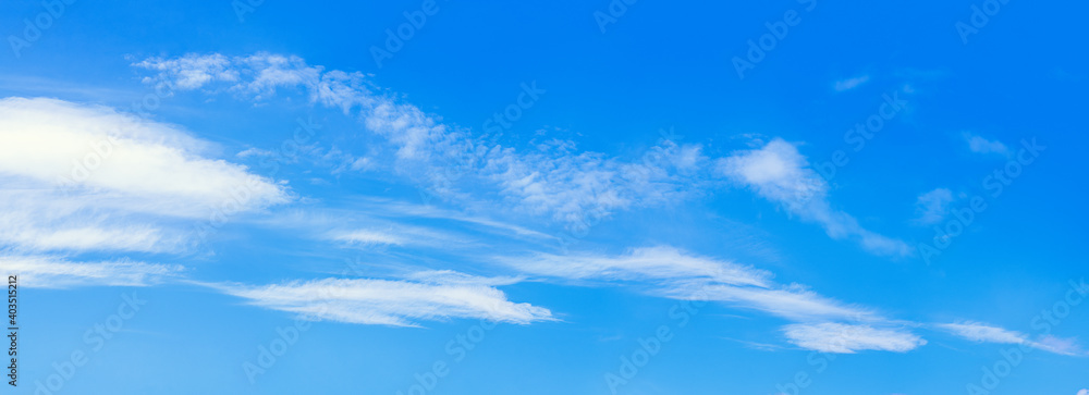 Background image of blue sky and light thin clouds.