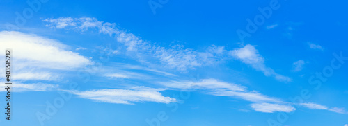 Background image of blue sky and light thin clouds.