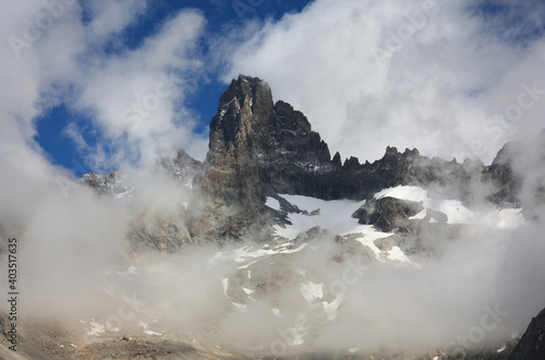 Mountain Peaks in the French Alps Enshrouded in Clouds