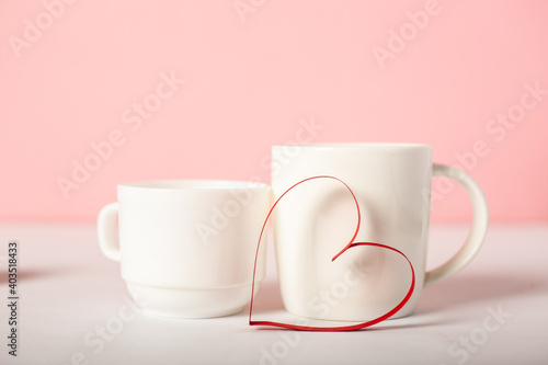 Festive composition for Valentine's Day. Mug and sweets on a pink background. Banner