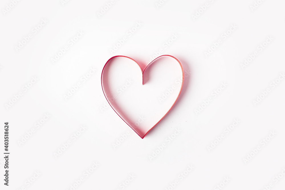 Red heart on a light white background. Composition Valentine's Day. Banner. Flat lay, top view