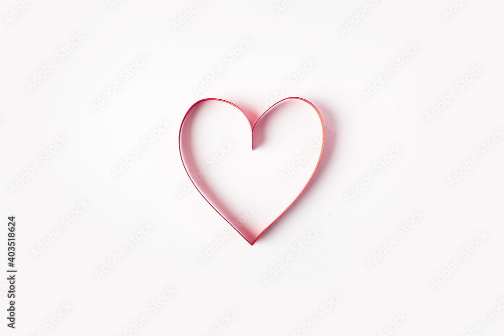 Red heart on a light white background. Composition Valentine's Day. Banner. Flat lay, top view Red heart on a light white background. Composition Valentine's Day. Banner. Flat lay, top view