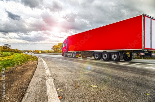Motion blurred trucks on highway. Logistics and transportation