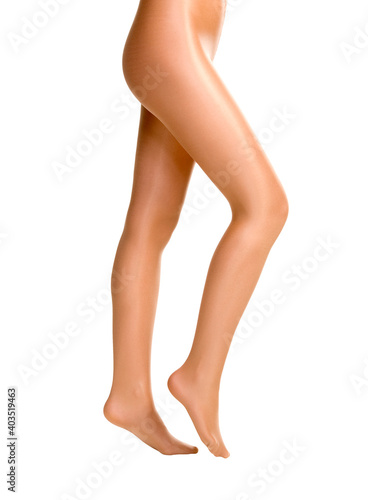 female legs in shiny pantyhose isolated on white background