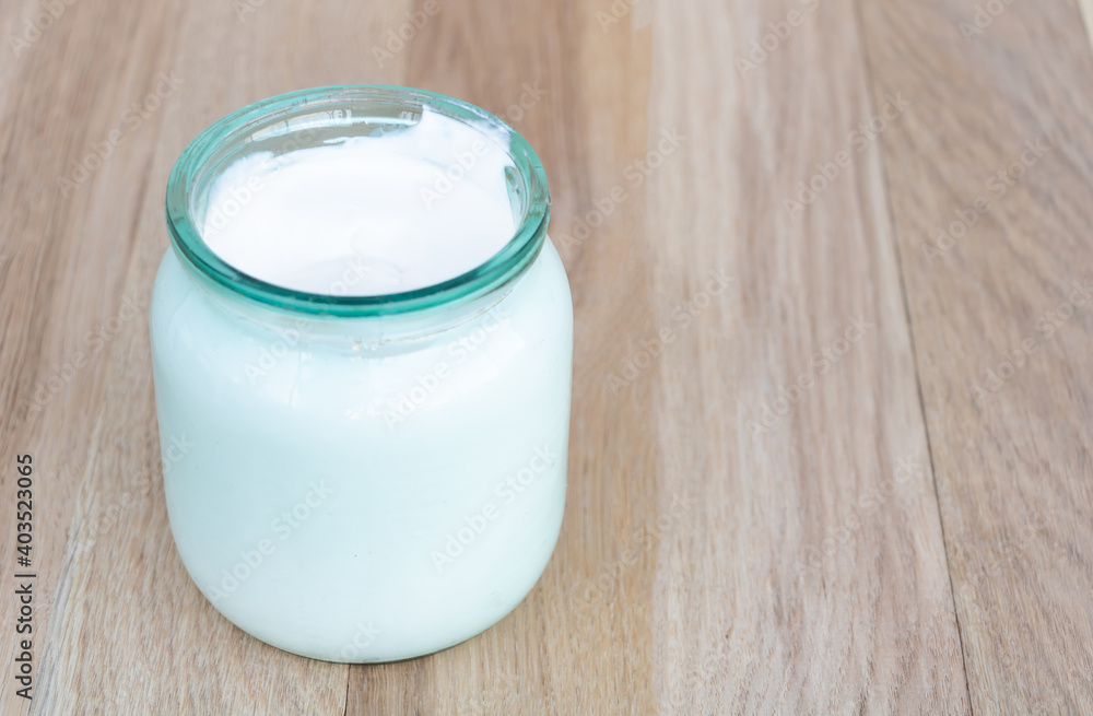 A jar of natural sour cream with many health benefits A jar of natural sour cream with many health benefits