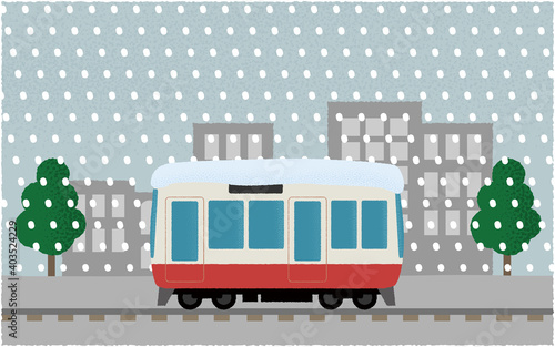 吹雪の中、都市を走る電車のベクターイラスト