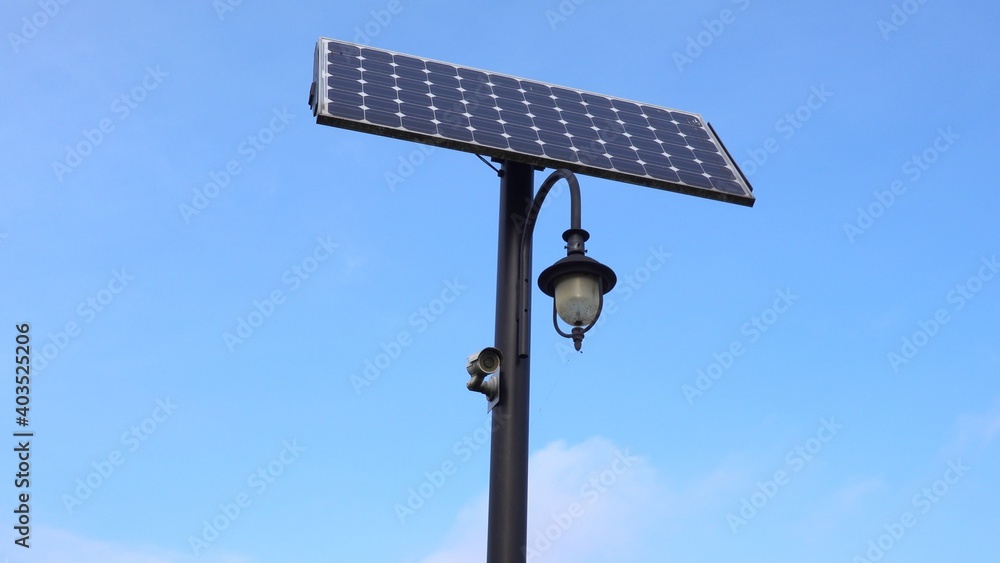 City Retro Street Lamp and Surveillance Camera Powered from Solar Panel City Retro Street Lamp and Surveillance Camera Powered from Solar Panel