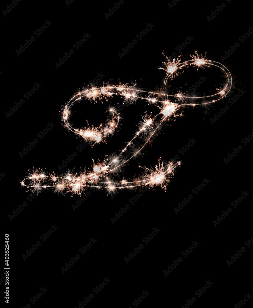 the letter t made from sparks of Bengal lights isolated on a black background. the letter t made from sparks of Bengal lights isolated on a black background.