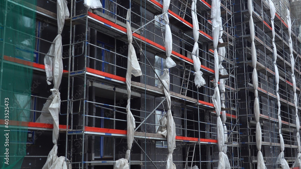 Scaffolding and Construction Safety Net on Builiding Facade Scaffolding and Construction Safety Net on Builiding Facade