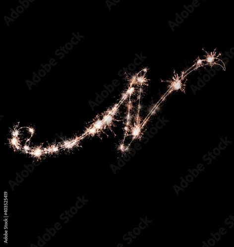 the letter l made from sparks of Bengal lights isolated on a black background.