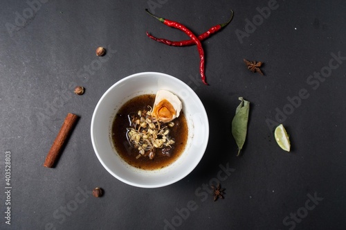 Rawon Rice or Nasi Rawon is a typical food of Surabaya, East Java. Rawon is usually equipped with salted eggs, short bean sprouts, and shrimp crackers. The bean sprouts give a crunchy and fresh  photo