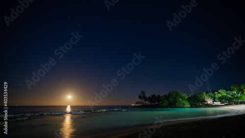Full moonset and moonrise in Hawaii