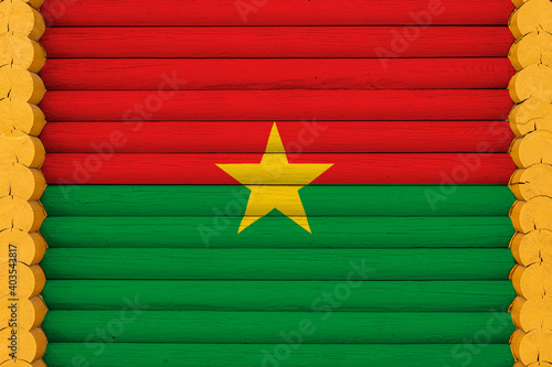 National flag  of Burkino Faso. on a wooden wall background. The concept of national pride and a symbol of the country. Flags painted on a house photo