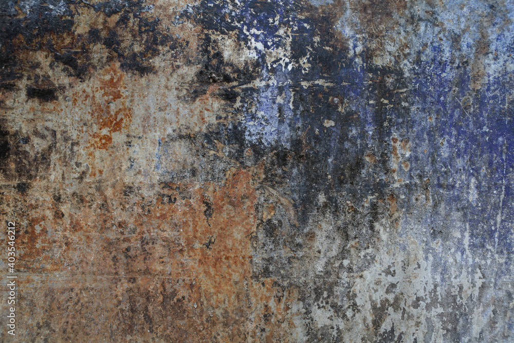 Old zinc texture background. Rusty metal plates with many colors and parts where the color has fallen and is seen rust.