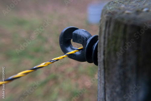 Electrical cord on a fence.