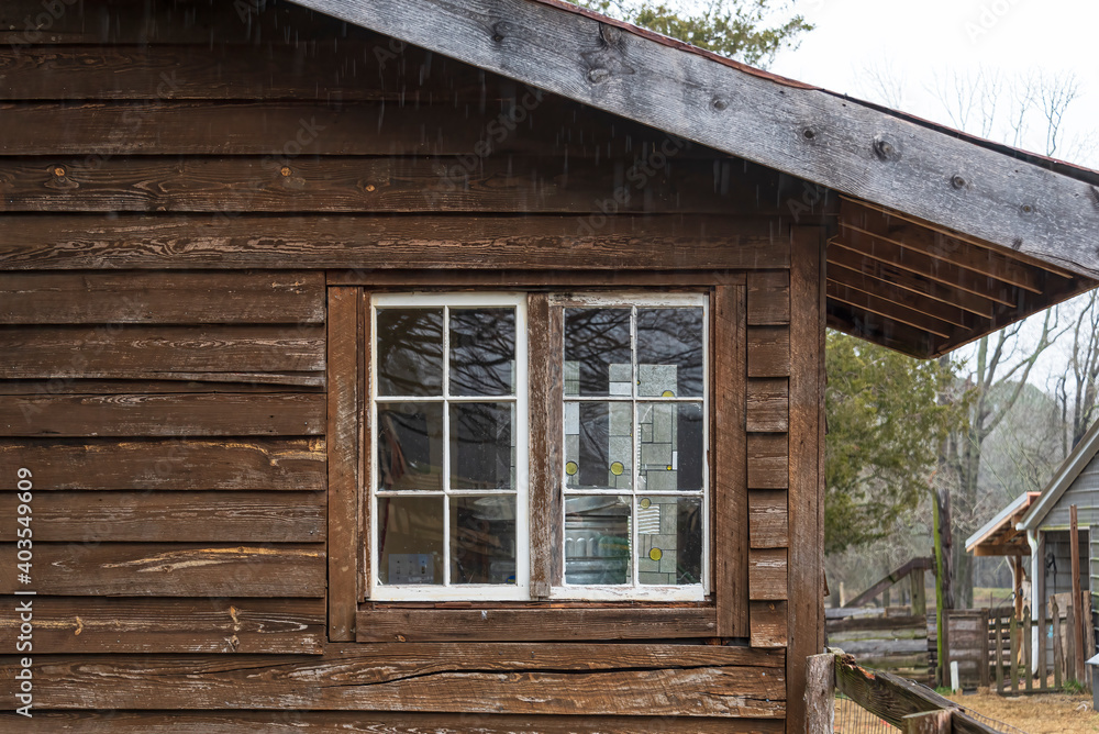 Couple of windows on an old wooden house. Couple of windows on an old wooden house.