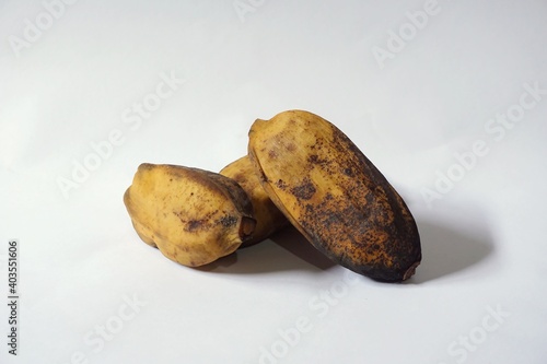 Grainy look of Pisang Rebus or Boiled Banana in white background. Pisang Kepok. Selective focus  photo