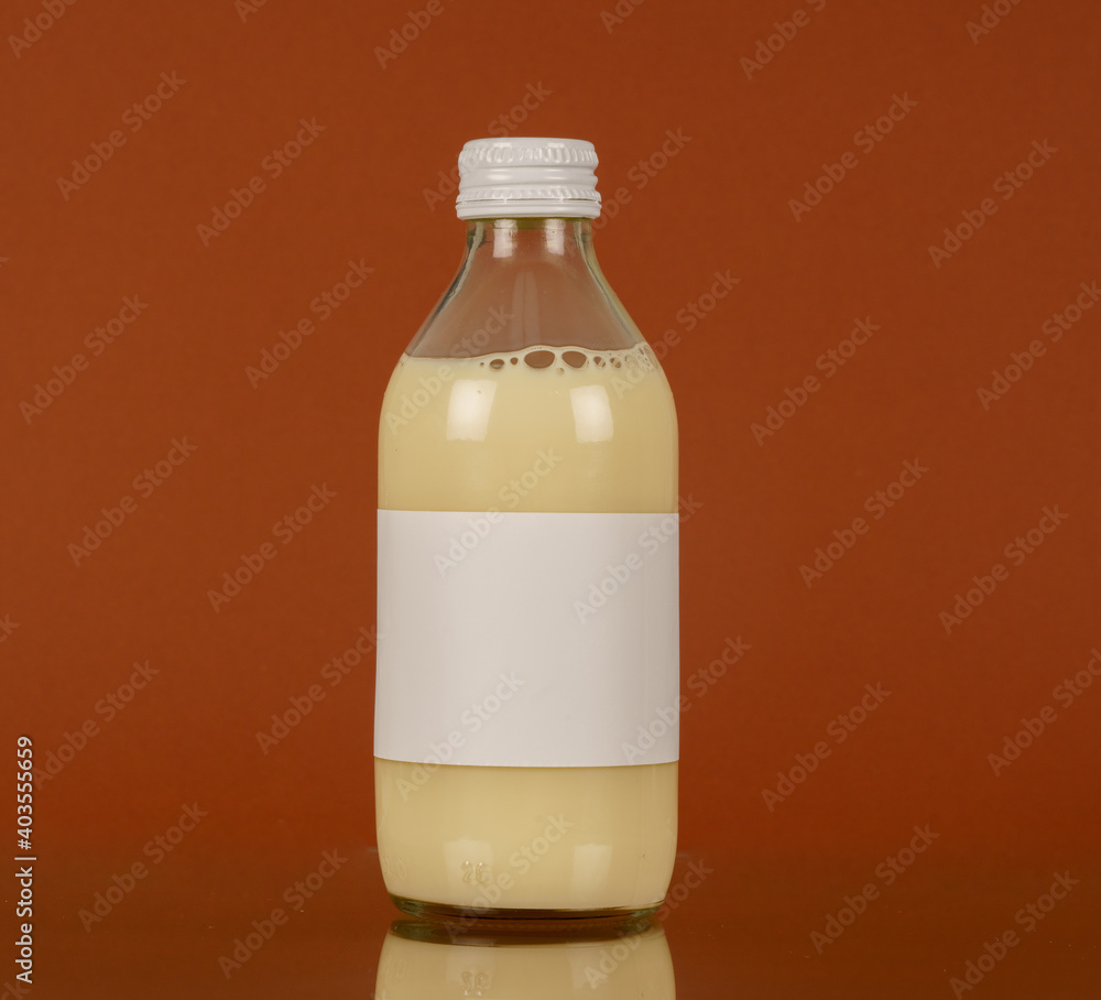 Small glass bottle with plant milk Small glass bottle with plant milk