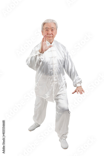 An old man is playing Tai Chi 