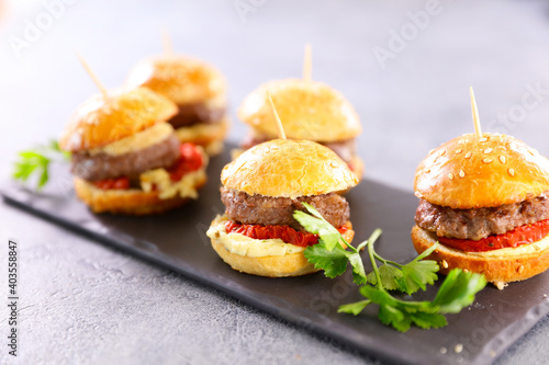 Obraz na płótnie mini hamburger withbeef, tomato and cheese snack