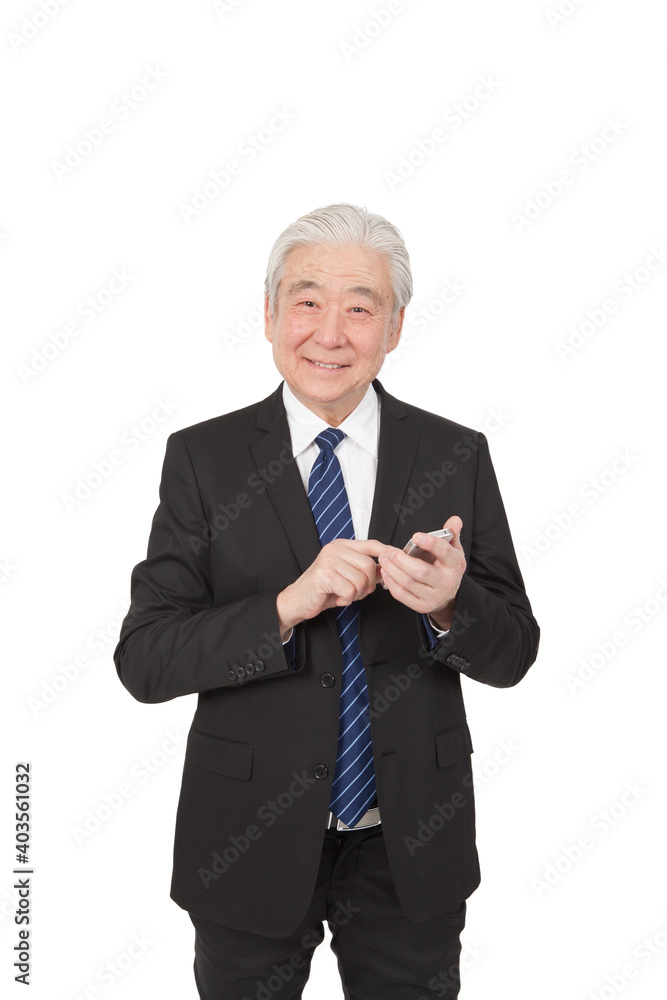An old senior businessman holding smart phone An old senior businessman holding smart phone