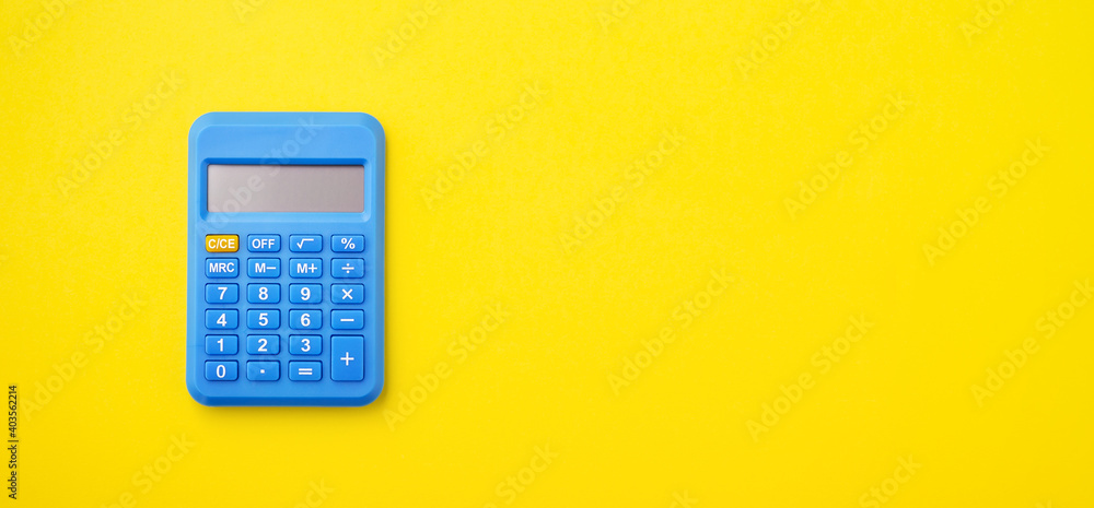 Blue calculator on yellow background Blue calculator on yellow background